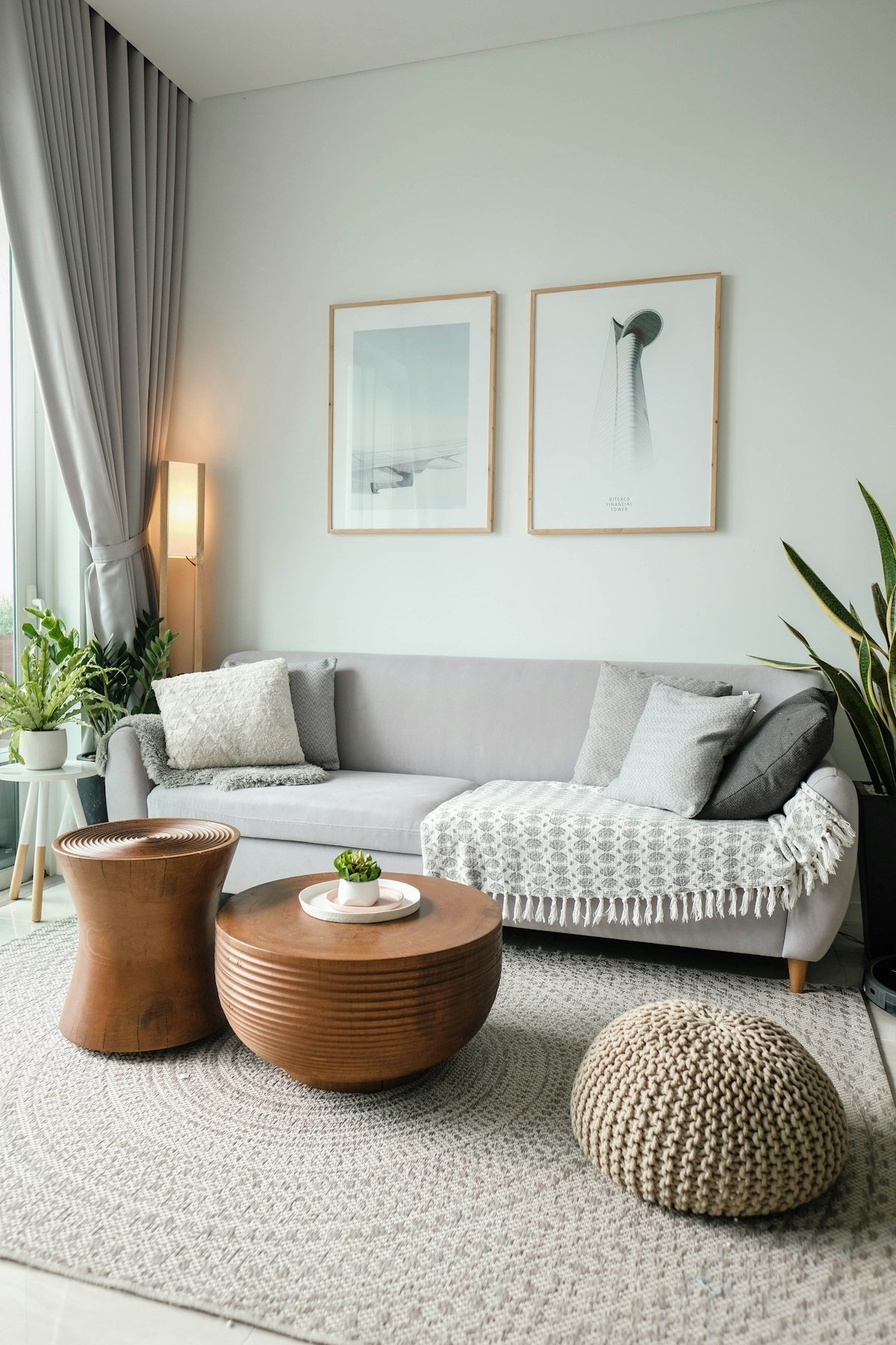 A bright, freshly cleaned living room with large windows and natural light